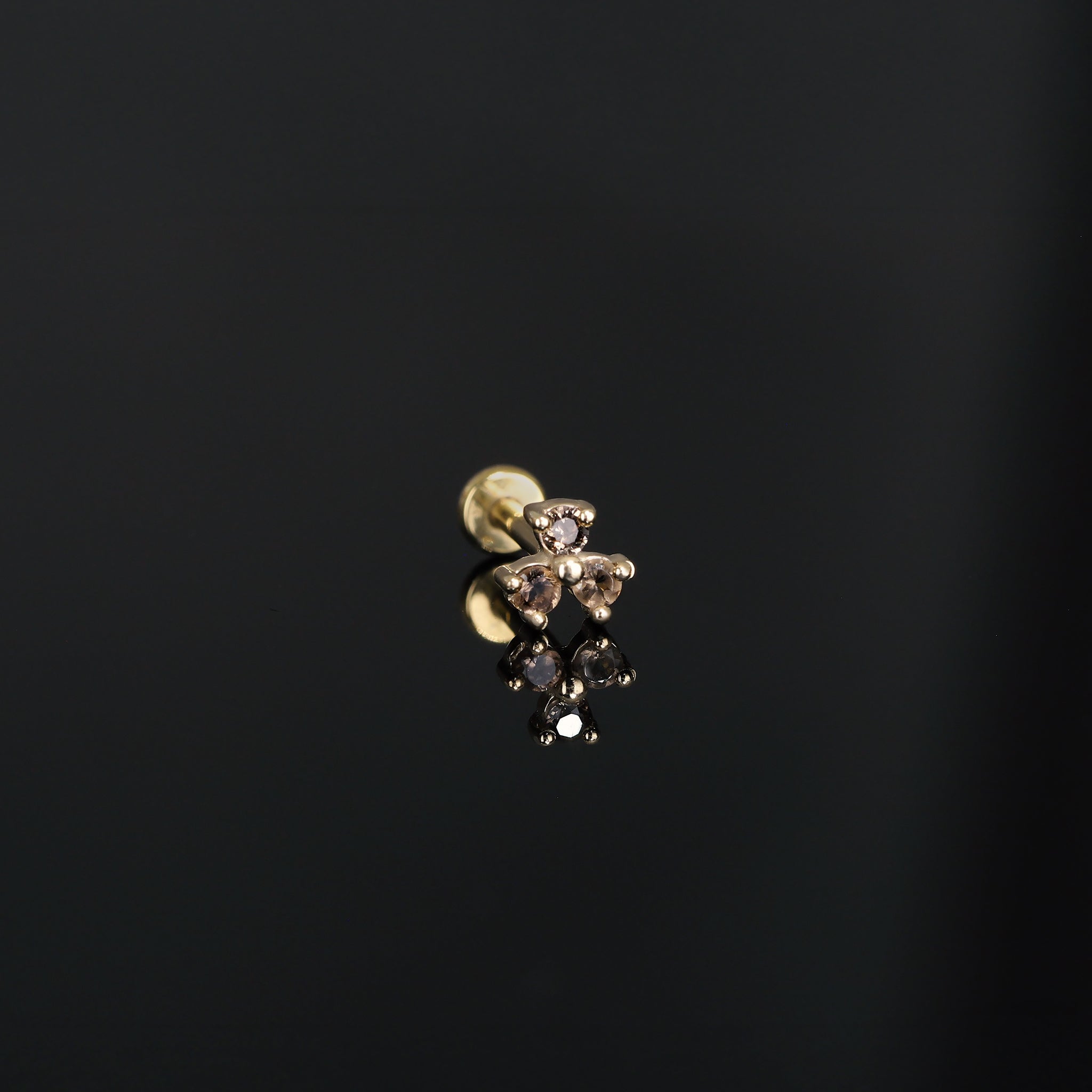 Threadless push pin, Ivy II, in Smoky Quartz displayed on dark surface.