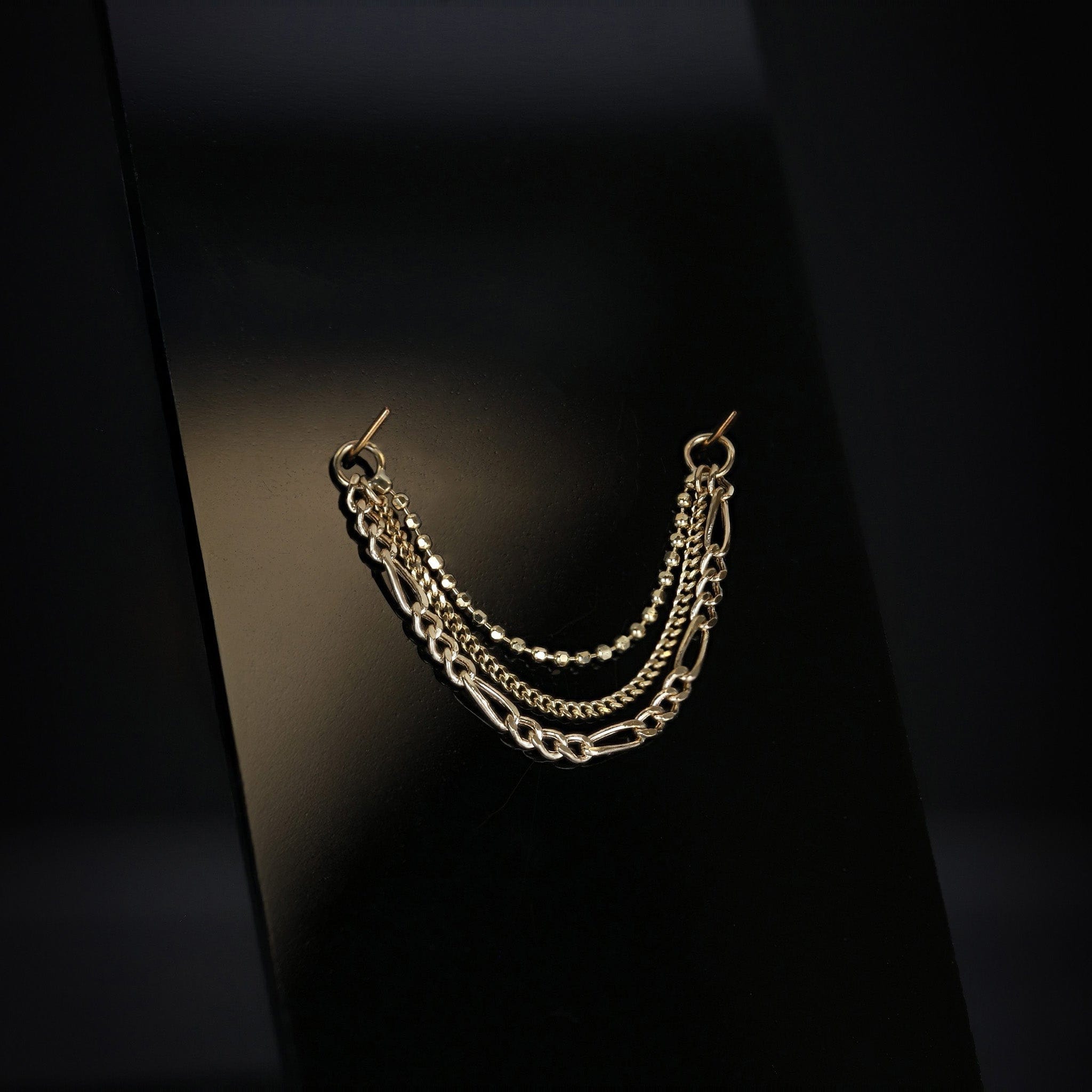 BEATTI 14K gold triple mixed chain attachment Quinn on black background
