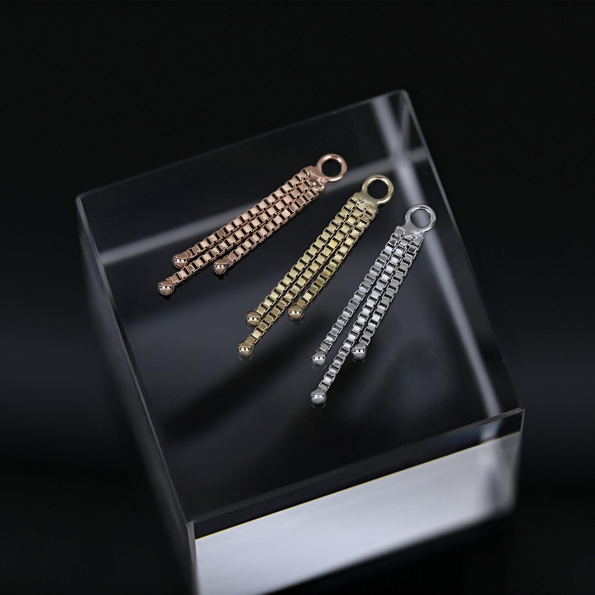 BEATTI 14K solid Gold soma chain charm on black background