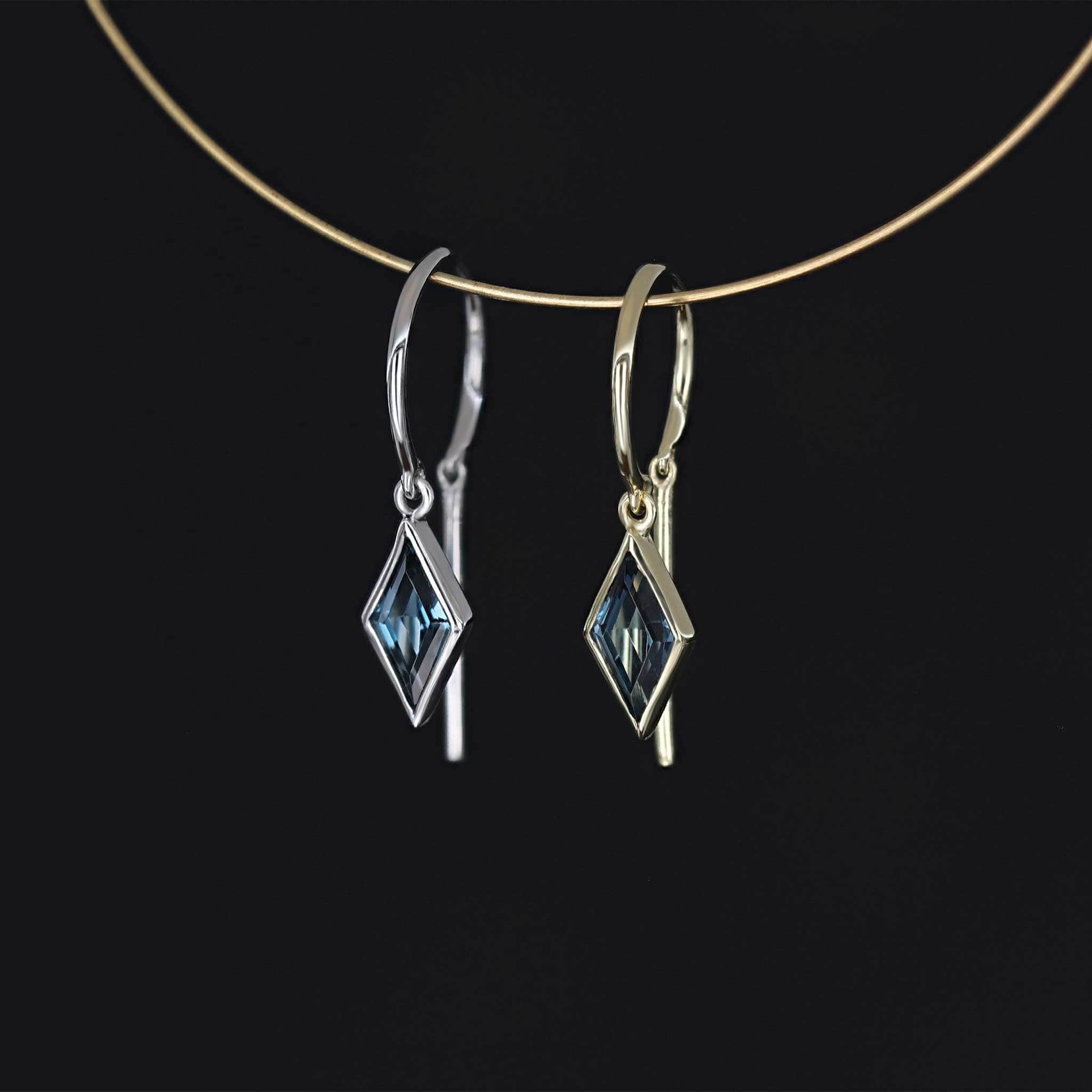 Ray open hoop earring with diamond cut london blue topaz in bezel setting
