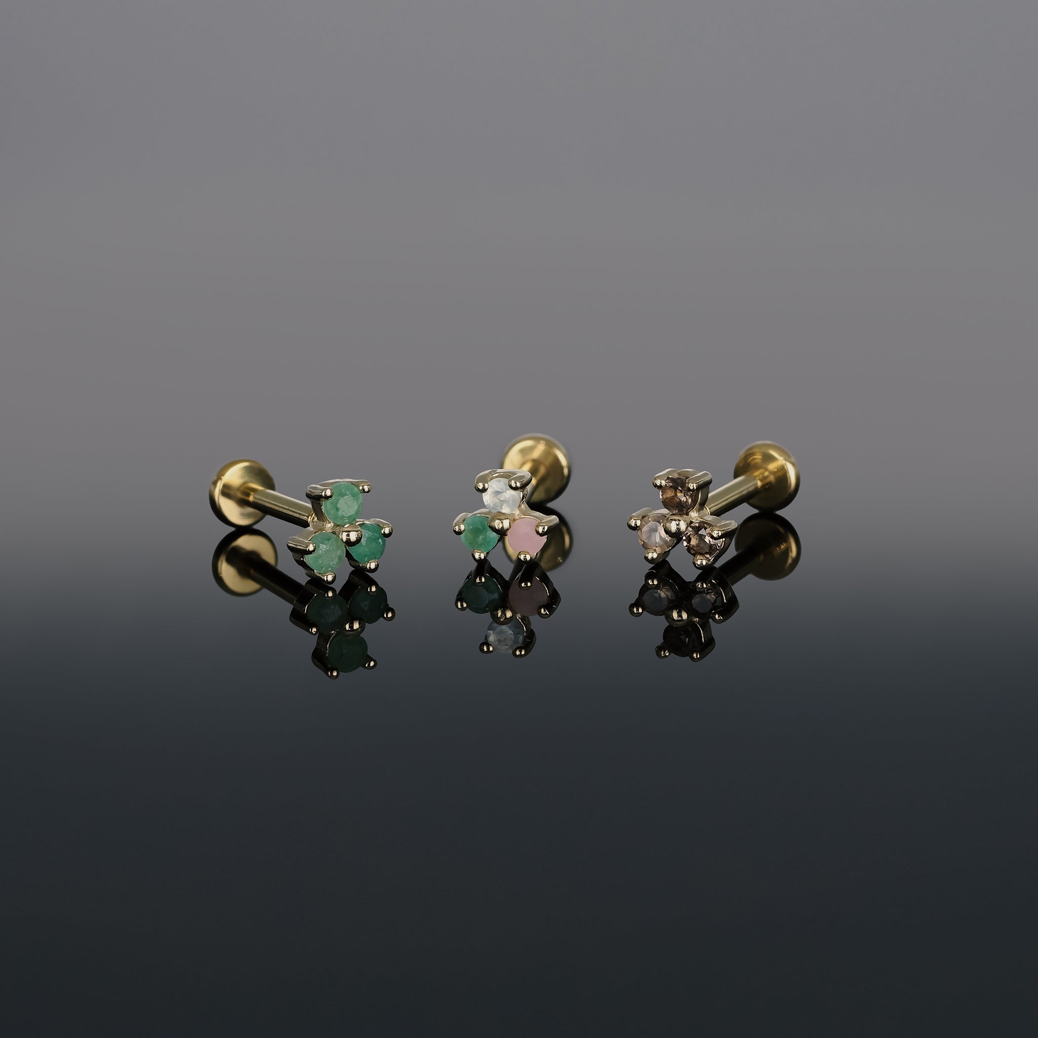 Threadless push pin, Ivy II in three types of stone options, Aventurine, Trio and Smoky quartz displayed on dark surface.