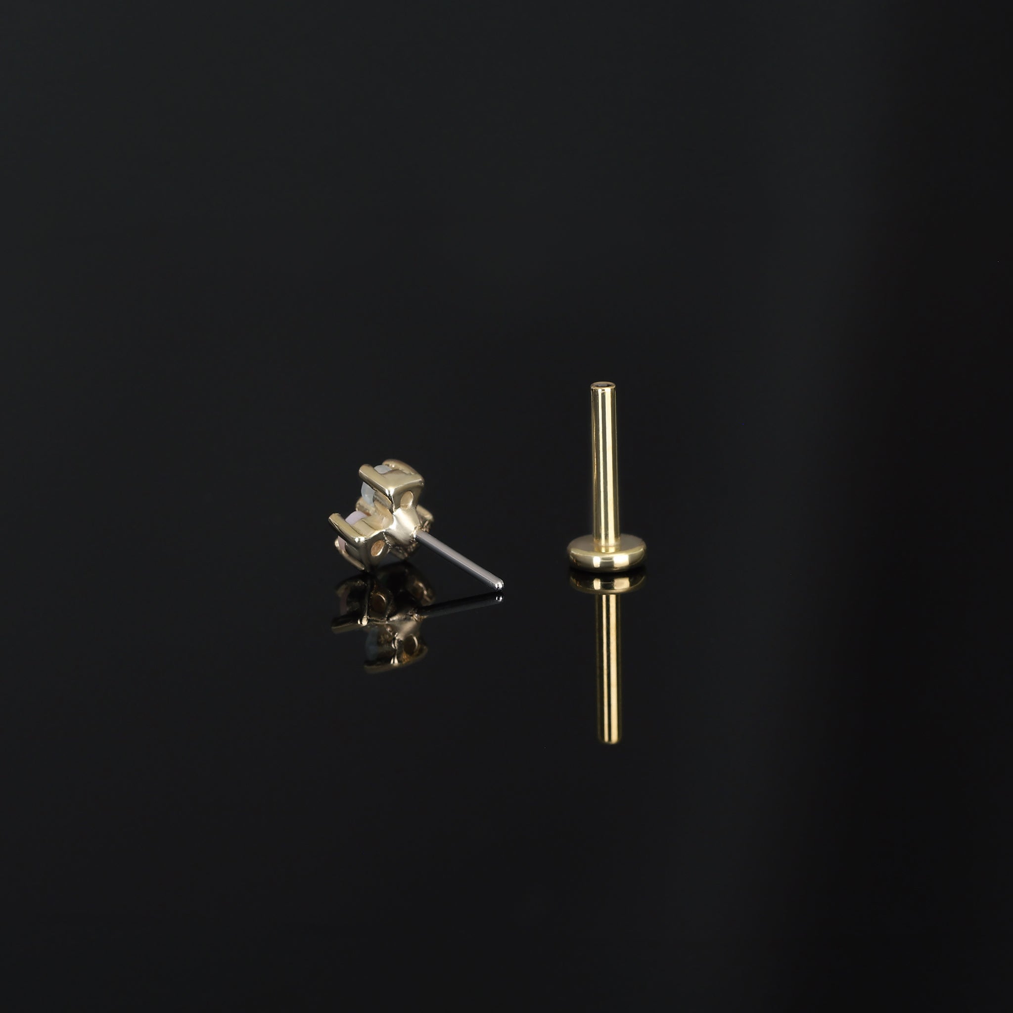 Back view of threadless push pin, Ivy II, on dark surface.