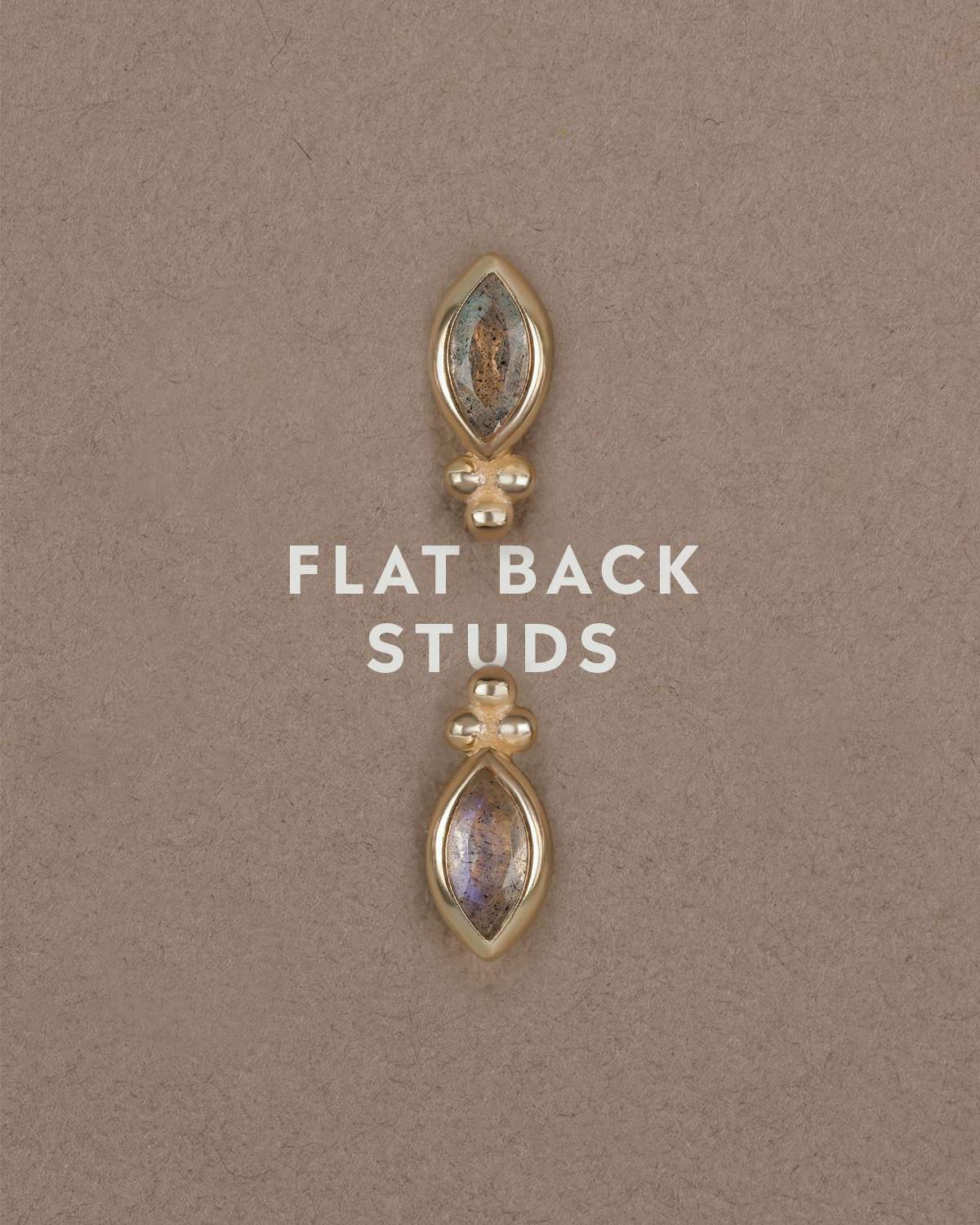 Gold gemstone studs, Rue displayed on beige textured surface with the text FLAT BACK STUDS in the middle