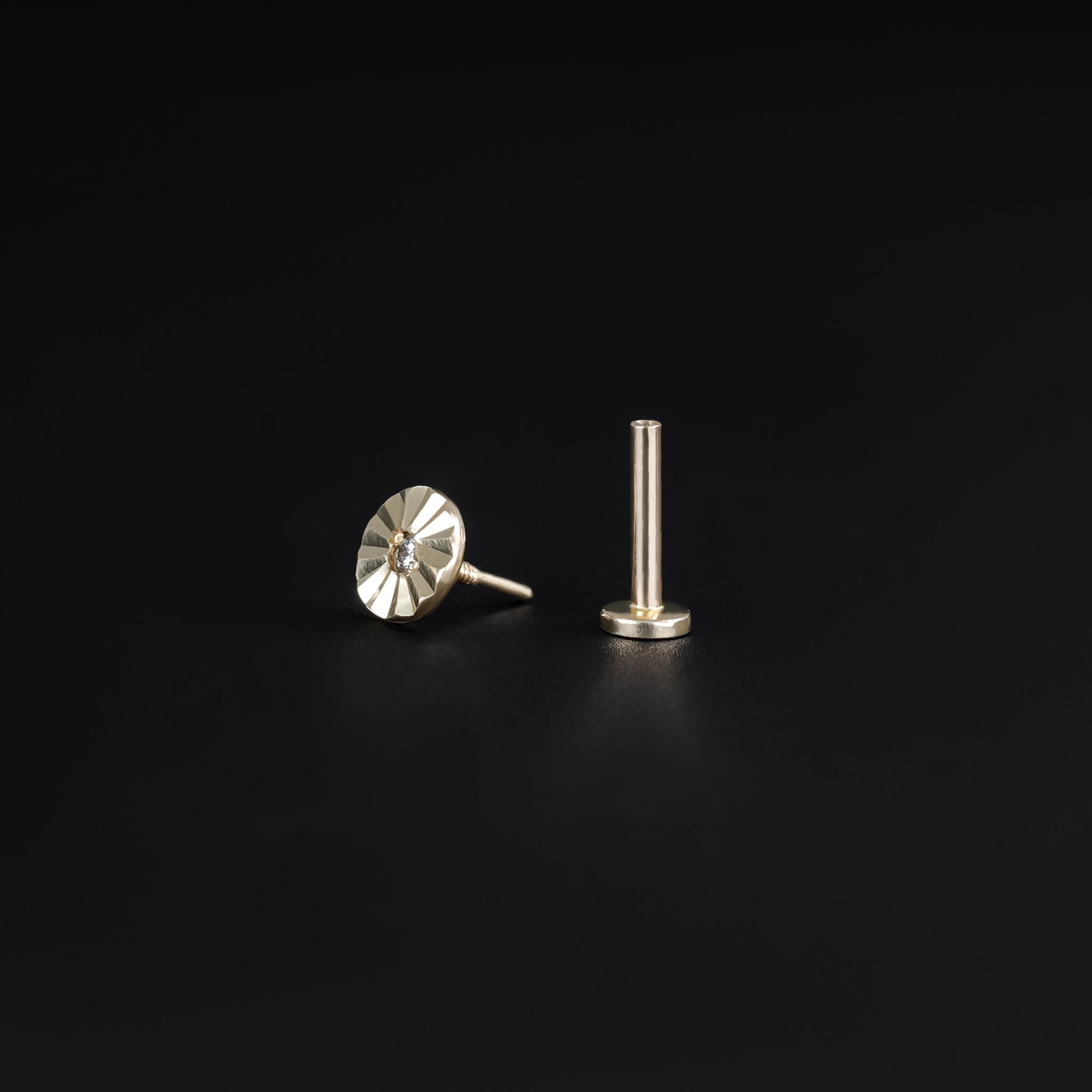 14k solid yellow gold flat disc studs with a diamond-cut pattern and post end