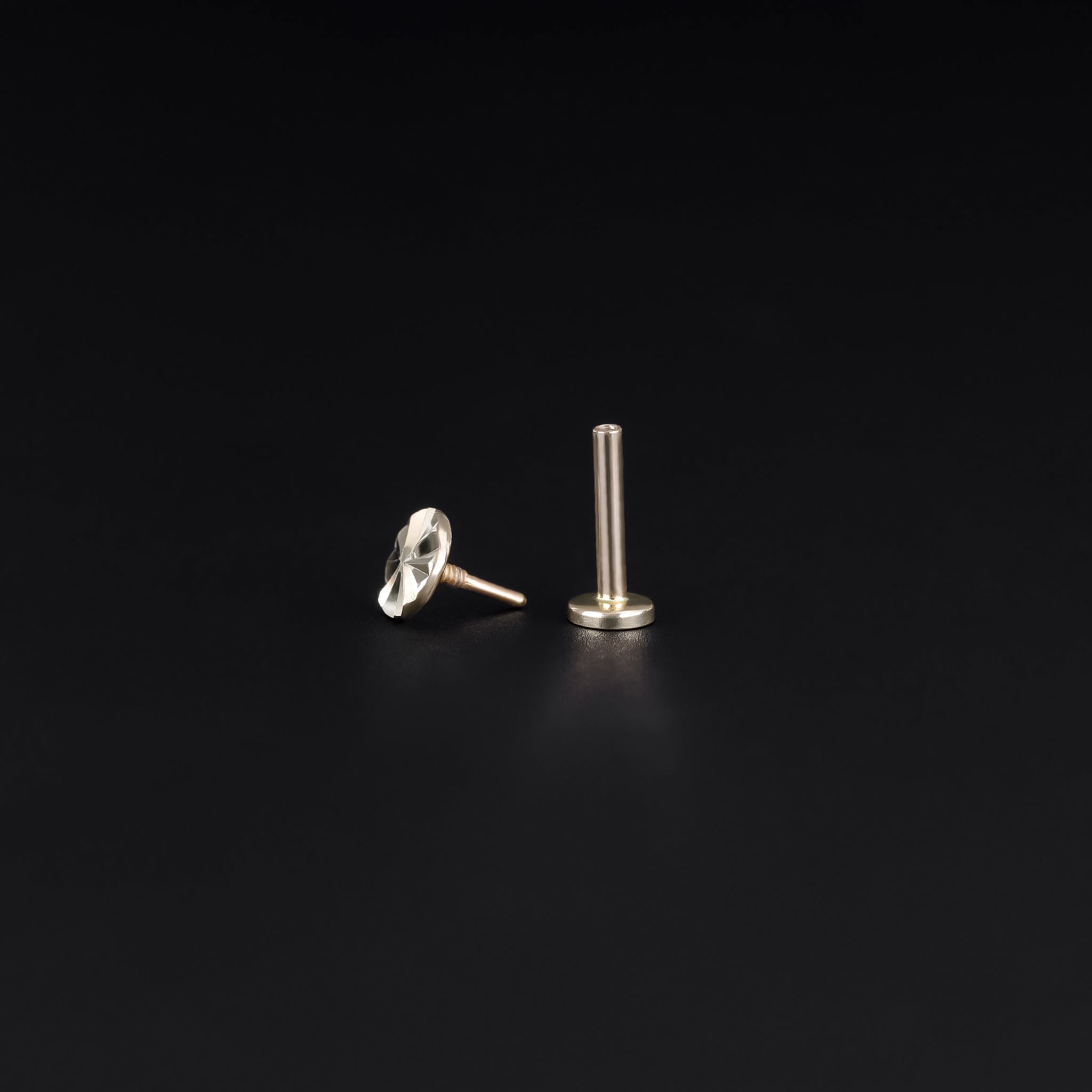 14K yellow and white gold studs with diamond-cut pattern on a flat round disc, 18G internally threaded design