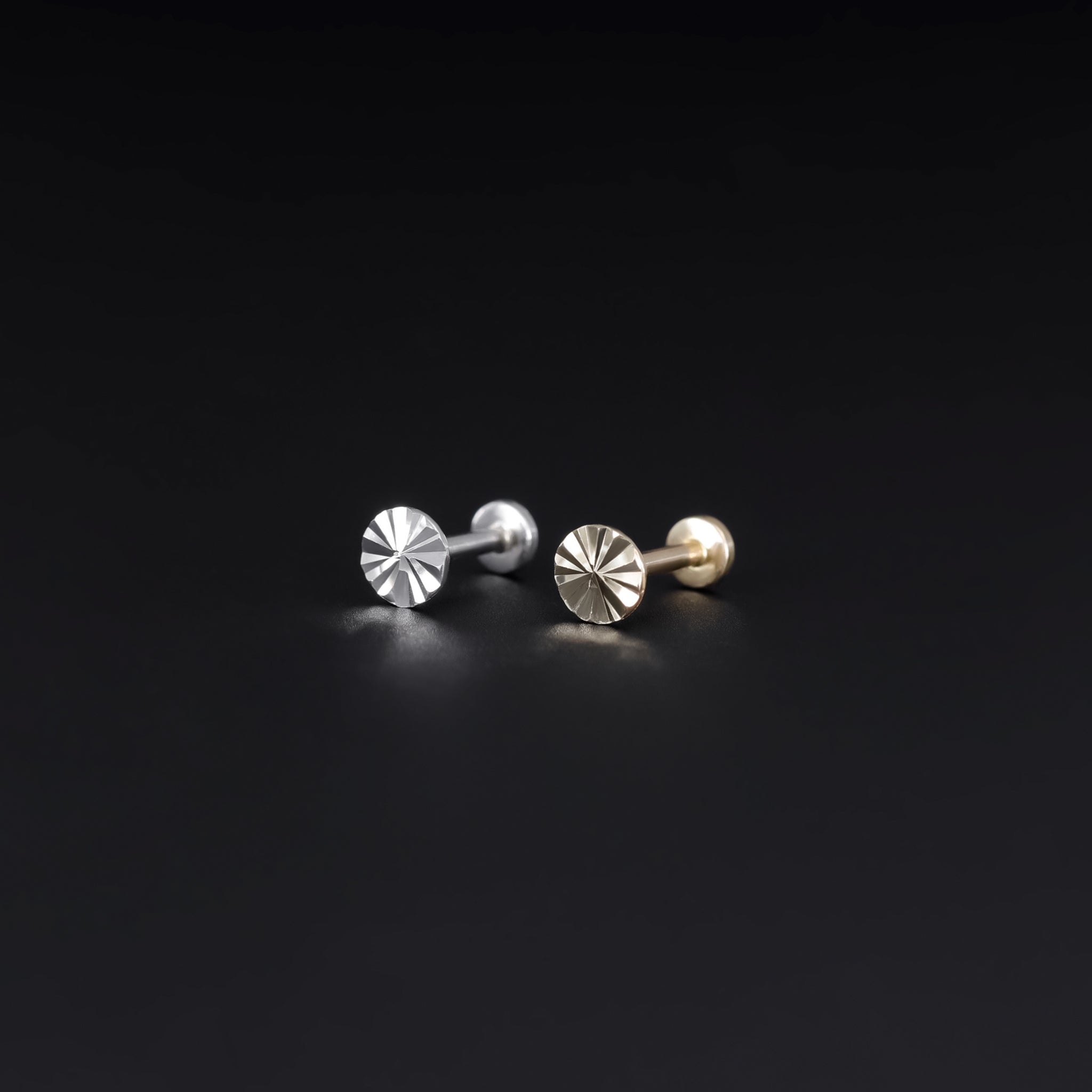 14K yellow and white gold studs with diamond-cut pattern on a flat round disc, 18G internally threaded design