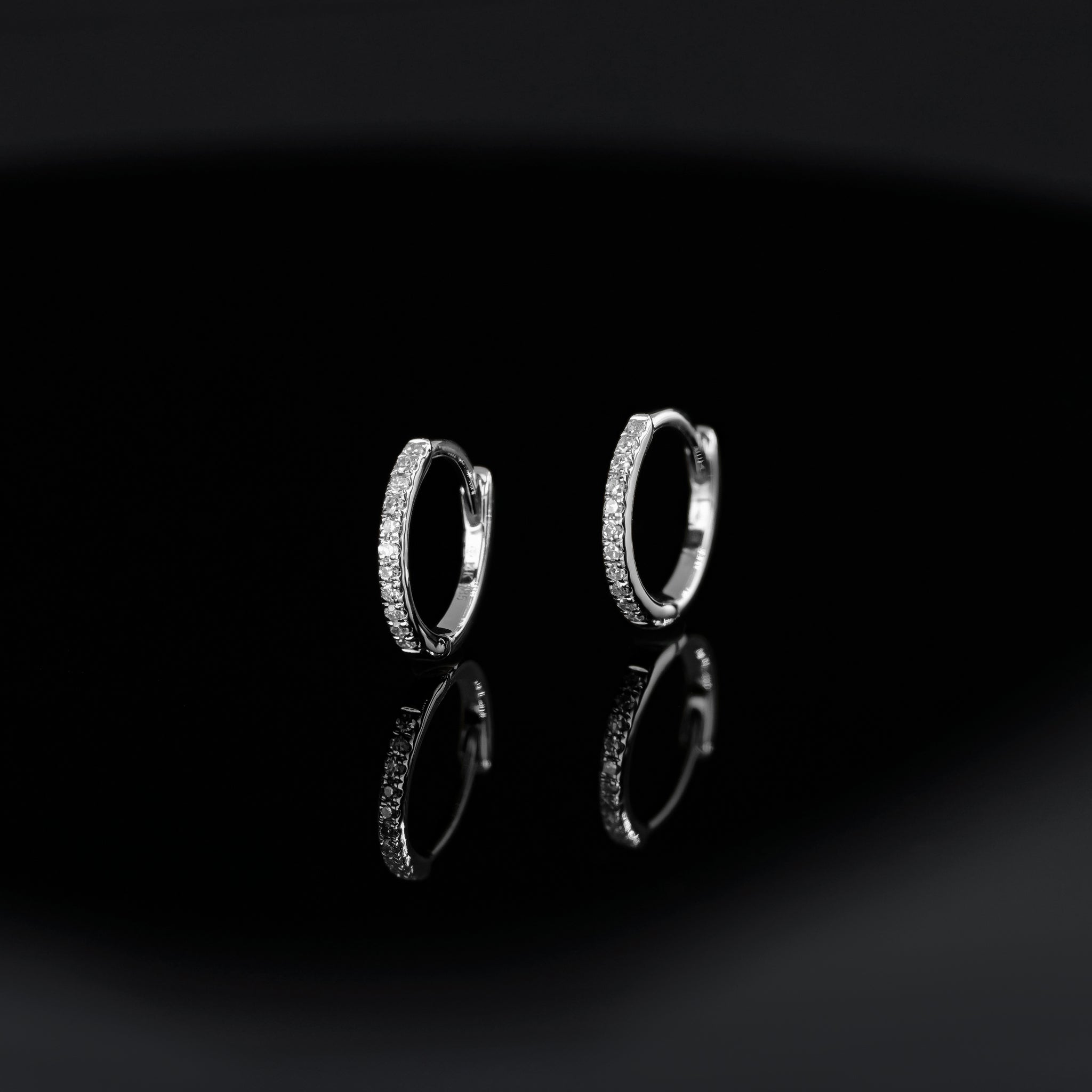 14K gold 10mm Diamond hoops in white gold displayed on black background