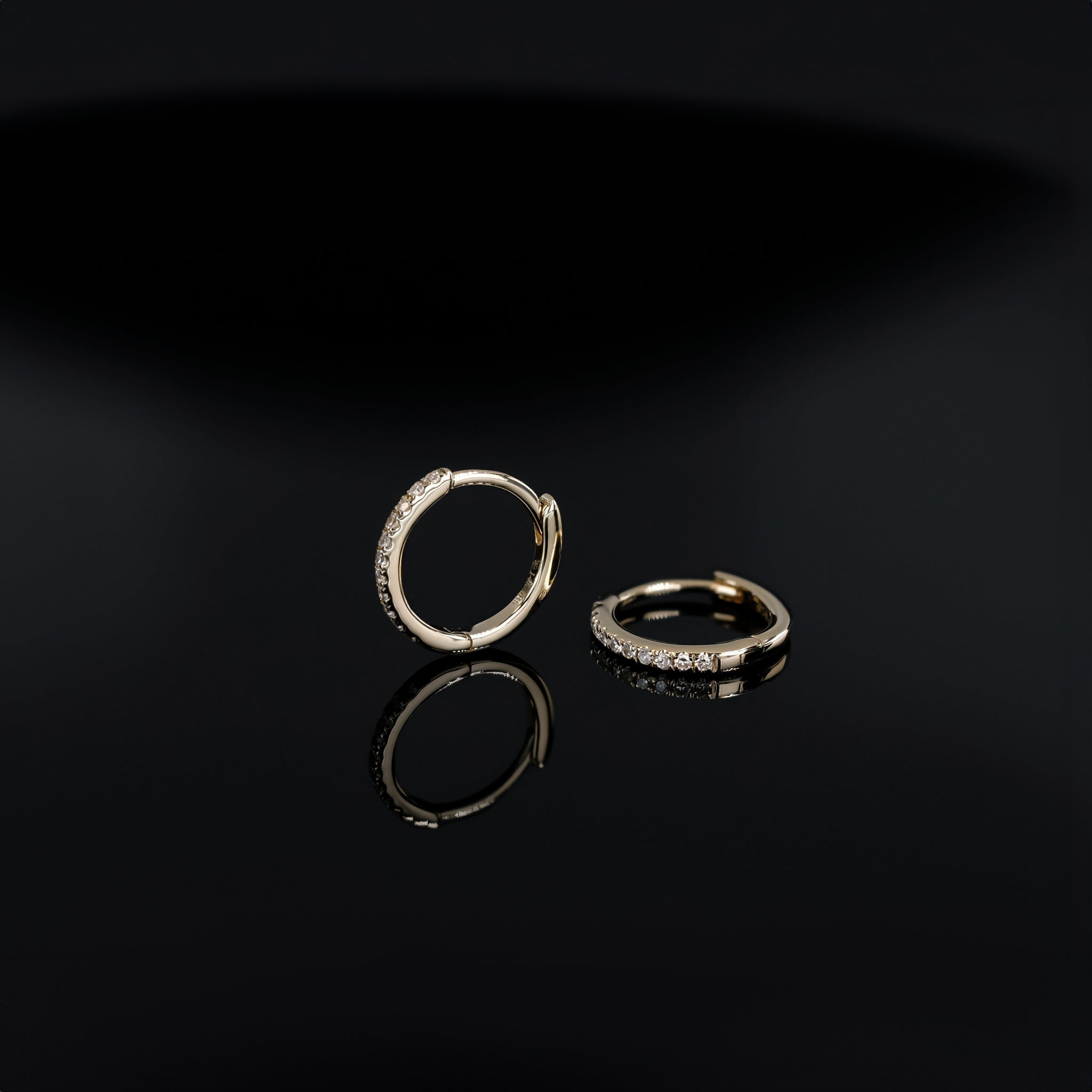 14K gold 10mm Diamond hoops in yellow gold displayed on black background