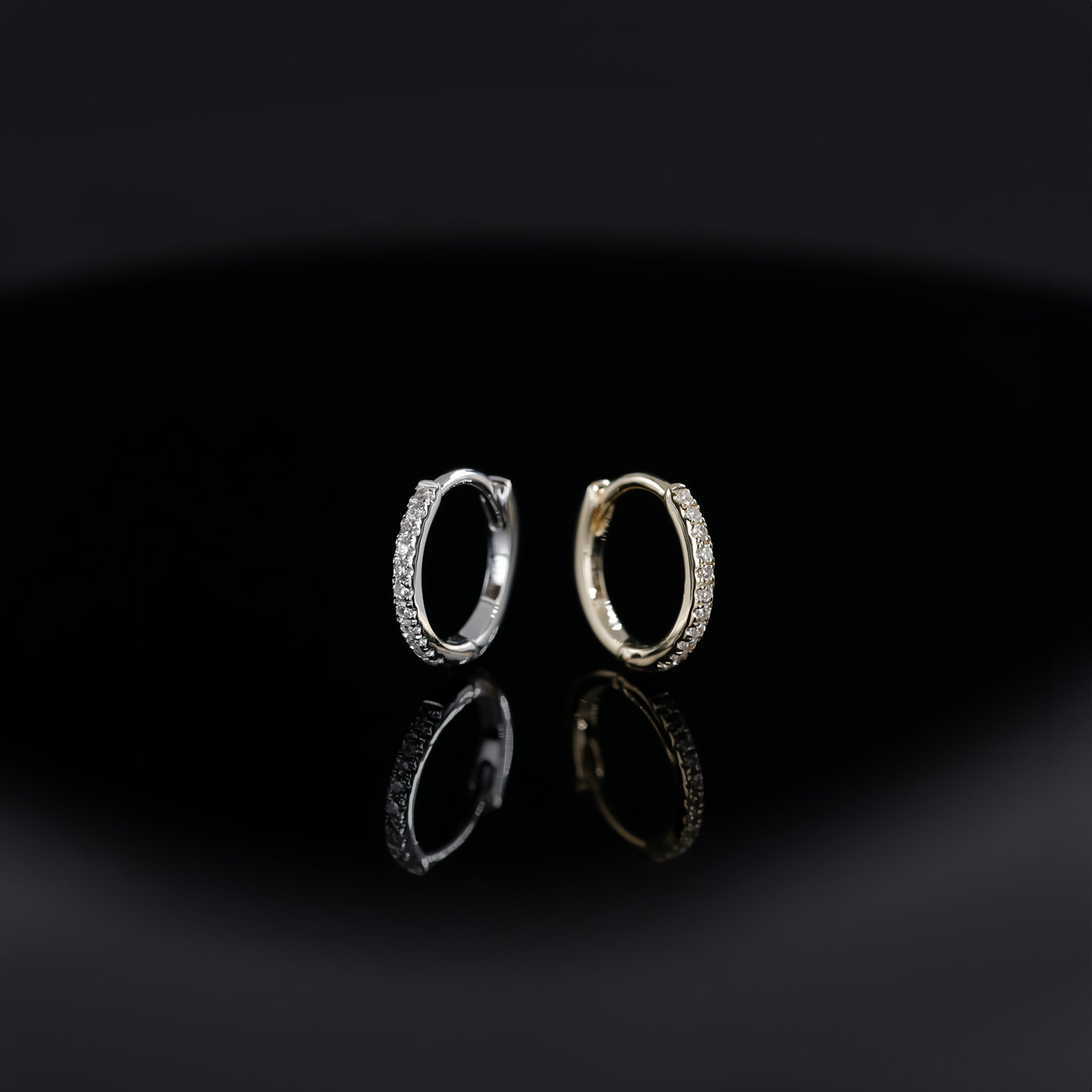 14K gold 10mm Diamond hoops in yellow gold and white gold displayed on black background